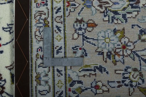Backside of handmade 2000s Kashan rug showing knot structure and weave density