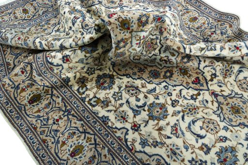 Surface texture of 2000s Kashan rug with natural Wool and intricate pattern