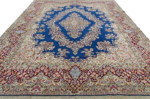 Surface texture of 1970s Kerman rug with natural Wool and intricate pattern