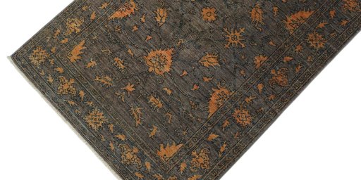 Backside of handmade New Farahan rug showing knot structure and weave density