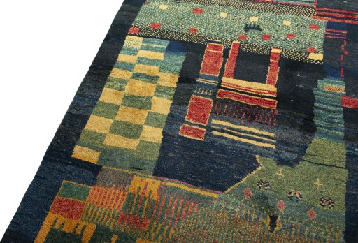 Backside of handmade 2000s Persian Gabbeh rug showing knot structure and weave density