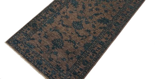 Backside of handmade New Farahan rug showing knot structure and weave density