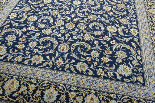 Close-up detail of 2000s Kashan rug from Iran / Persia showing Wool weave