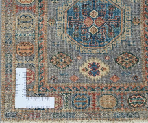 Corner detail of New Kazak rug showing border pattern and Wool pile