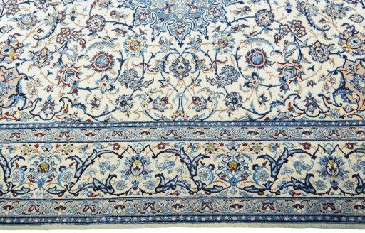 Corner detail of 2000s Nain rug showing border pattern and Wool pile