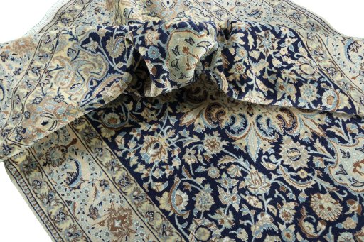 Surface texture of 2000s Nain rug with natural Wool and intricate pattern