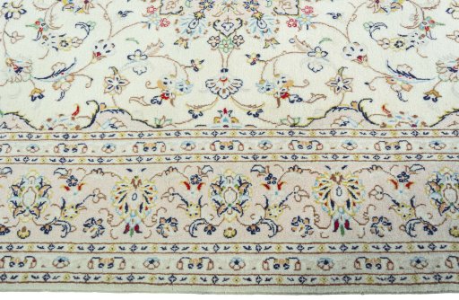 Corner detail of New Kashan rug showing border pattern and Wool pile