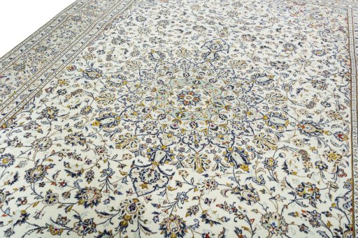 Backside of handmade 2000s Kashan rug showing knot structure and weave density