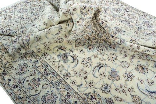 Surface texture of 2000s Nain rug with natural Wool and intricate pattern