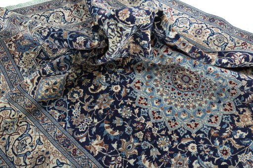Surface texture of 2000s Nain rug with natural Wool and intricate pattern