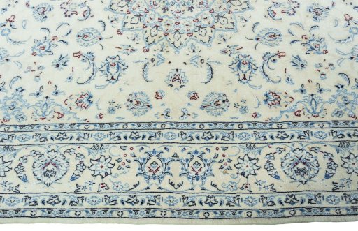 Corner detail of New Nain rug showing border pattern and Wool pile