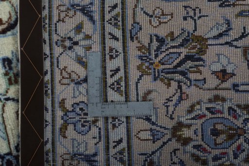 Backside of handmade 2000s Kashan rug showing knot structure and weave density