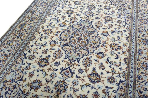 Backside of handmade 2000s Kashan rug showing knot structure and weave density