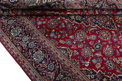 Close-up detail of 2000s Kashan rug from Iran / Persia showing Wool weave
