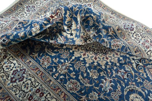 Surface texture of 2000s Nain rug with natural Wool and intricate pattern
