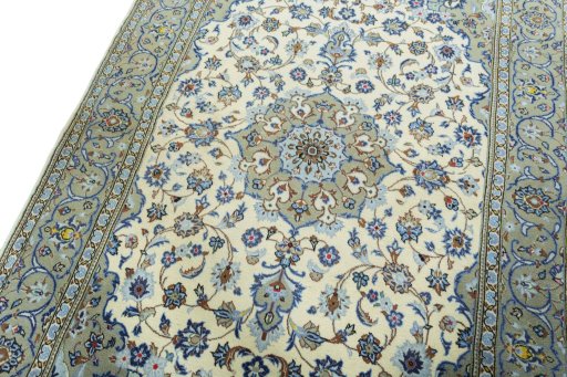 Backside of handmade 2000s Kashan rug showing knot structure and weave density