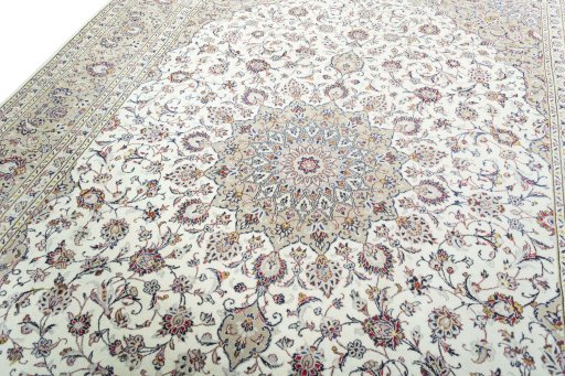 Backside of handmade 2000s Kashan rug showing knot structure and weave density