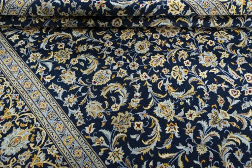 Close-up detail of 2000s Kashan rug from Iran / Persia showing Wool weave