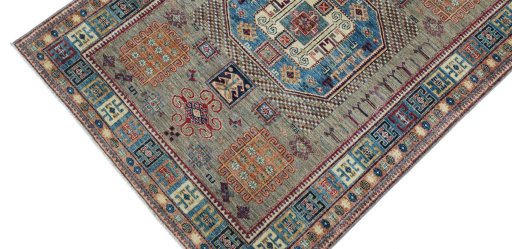 Backside of handmade New Kazak rug showing knot structure and weave density