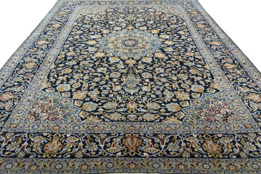 Surface texture of 2000s Kashan rug with natural Wool and intricate pattern