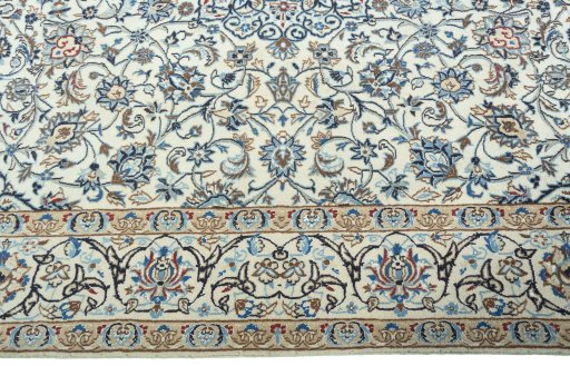 Corner detail of 2000s Nain rug showing border pattern and Wool pile