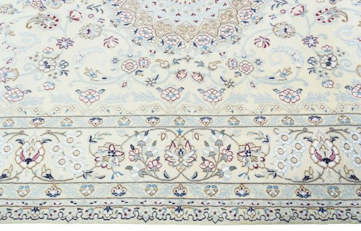 Corner detail of 2000s Nain rug showing border pattern and Wool pile