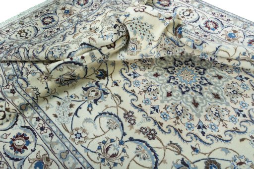 Surface texture of 2000s Nain rug with natural Wool and intricate pattern