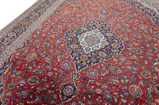 Backside of handmade New Kashan rug showing knot structure and weave density