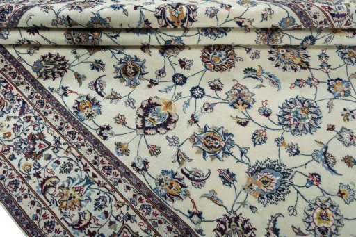 Close-up detail of 2000s Mashad rug from Iran / Persia showing Wool weave
