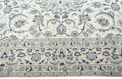 Corner detail of 2000s Nain rug showing border pattern and Wool pile