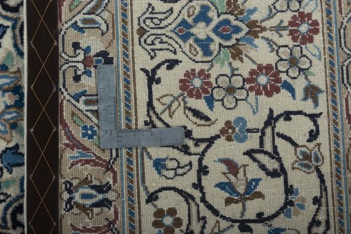 Backside of handmade 2000s Nain rug showing knot structure and weave density