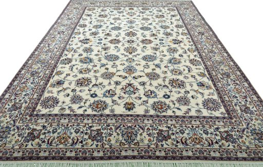 Surface texture of 2000s Mashad rug with natural Wool and intricate pattern