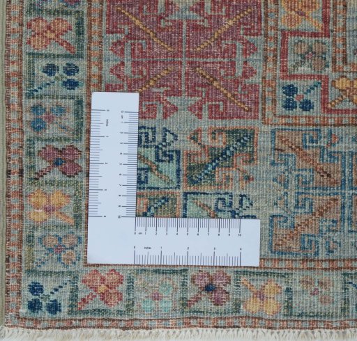 Corner detail of New Kazak rug showing border pattern and Wool pile