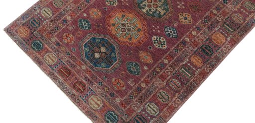 Backside of handmade New Kazak rug showing knot structure and weave density