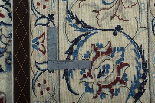 Backside of handmade 2000s Nain rug showing knot structure and weave density