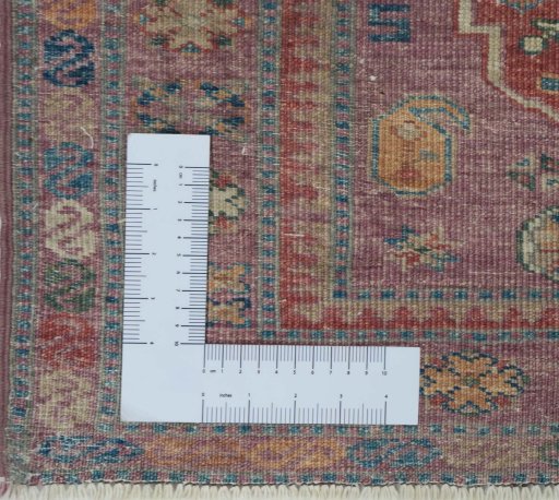 Corner detail of New Kazak rug showing border pattern and Wool pile