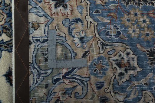 Backside of handmade 2000s Kashan rug showing knot structure and weave density