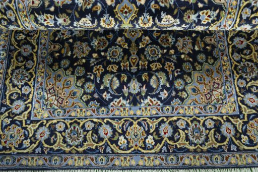 Close-up detail of 2000s Kashan rug from Iran / Persia showing Wool weave