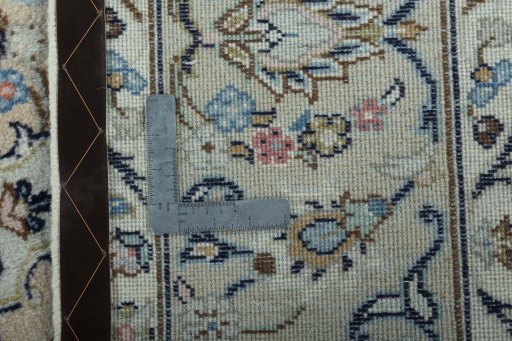 Backside of handmade 2000s Kashan rug showing knot structure and weave density
