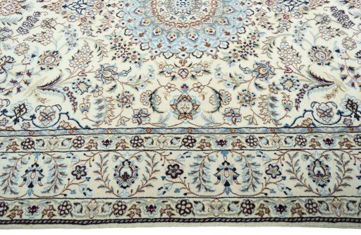 Corner detail of 2000s Nain rug showing border pattern and Wool pile