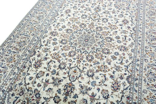 Backside of handmade 2000s Kashan rug showing knot structure and weave density