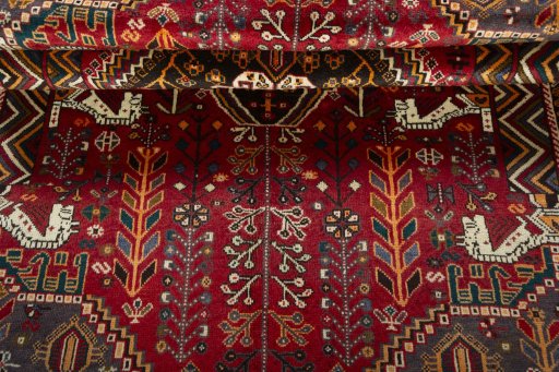 Corner detail of 2000s Shiraz rug showing border pattern and Wool pile