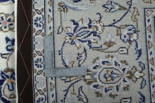 Backside of handmade 2000s Kashan rug showing knot structure and weave density