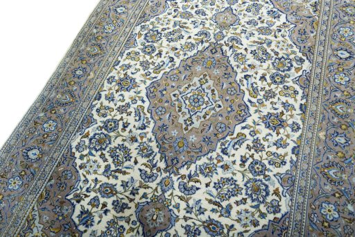 Backside of handmade 2000s Kashan rug showing knot structure and weave density