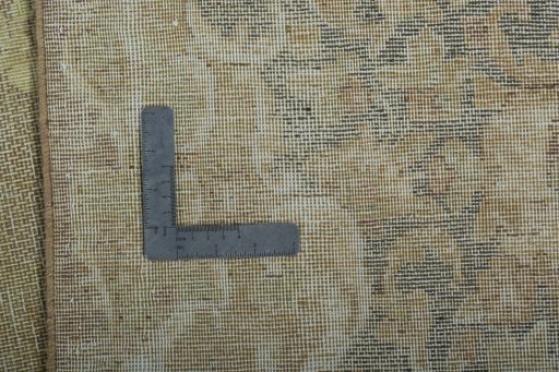 Backside of handmade 1970s Vintage rug showing knot structure and weave density
