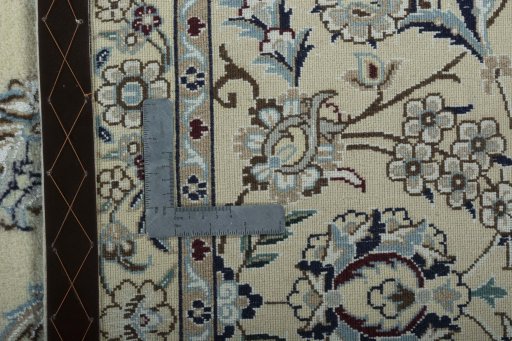 Backside of handmade 2000s Nain rug showing knot structure and weave density