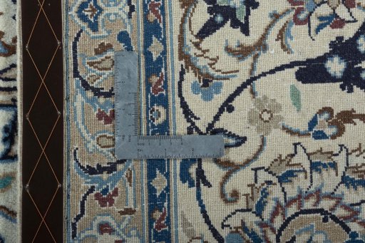 Backside of handmade New Nain rug showing knot structure and weave density