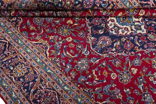 Close-up detail of 2000s Kashan rug from Iran / Persia showing Wool weave