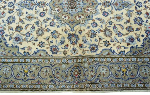 Corner detail of 2000s Kashan rug showing border pattern and Wool pile