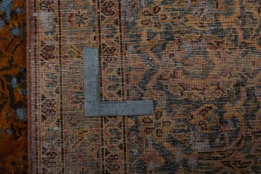 Surface texture of 1970s Vintage rug with natural Wool and intricate pattern